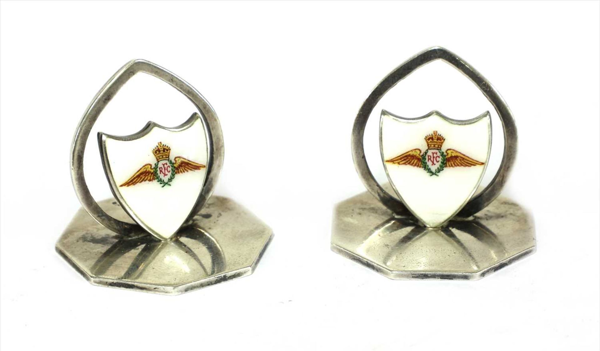 A pair of silver and enamel Royal Flying Corps place settings,