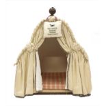 An upholstered dog kennel,