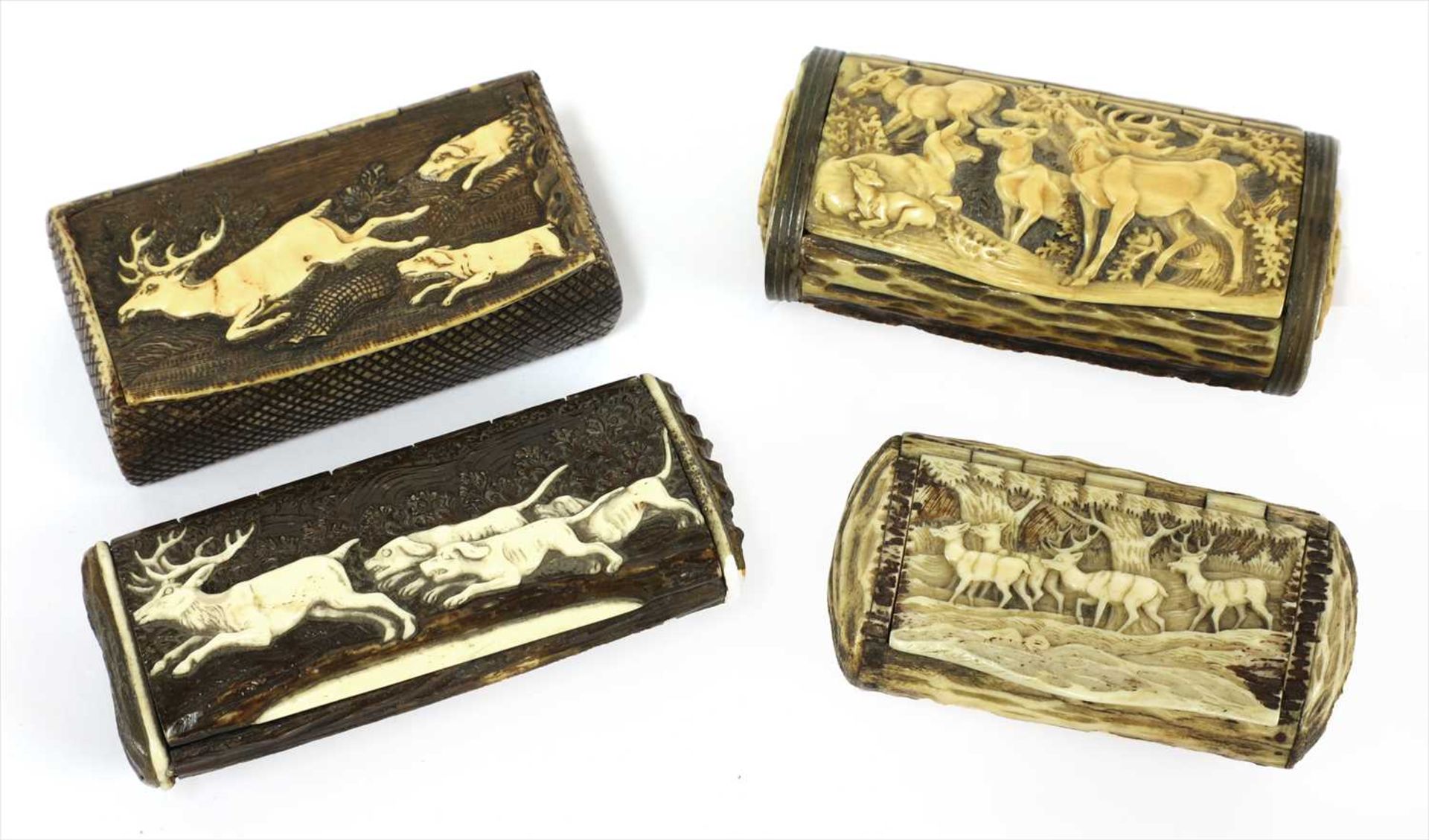 Four carved antler snuff boxes