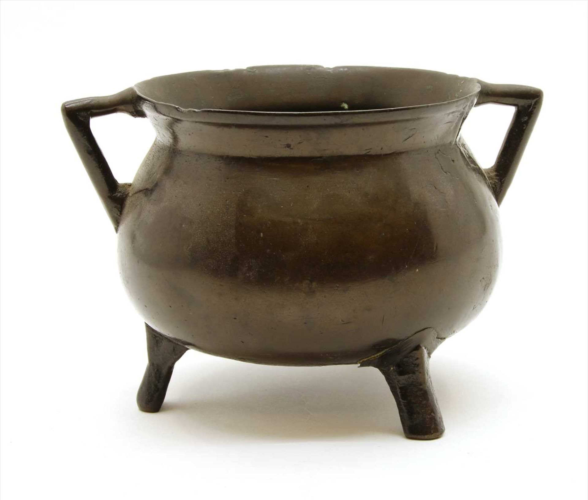 A bronze cauldron,