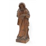 A Tyrolean carved pine figure of a monk