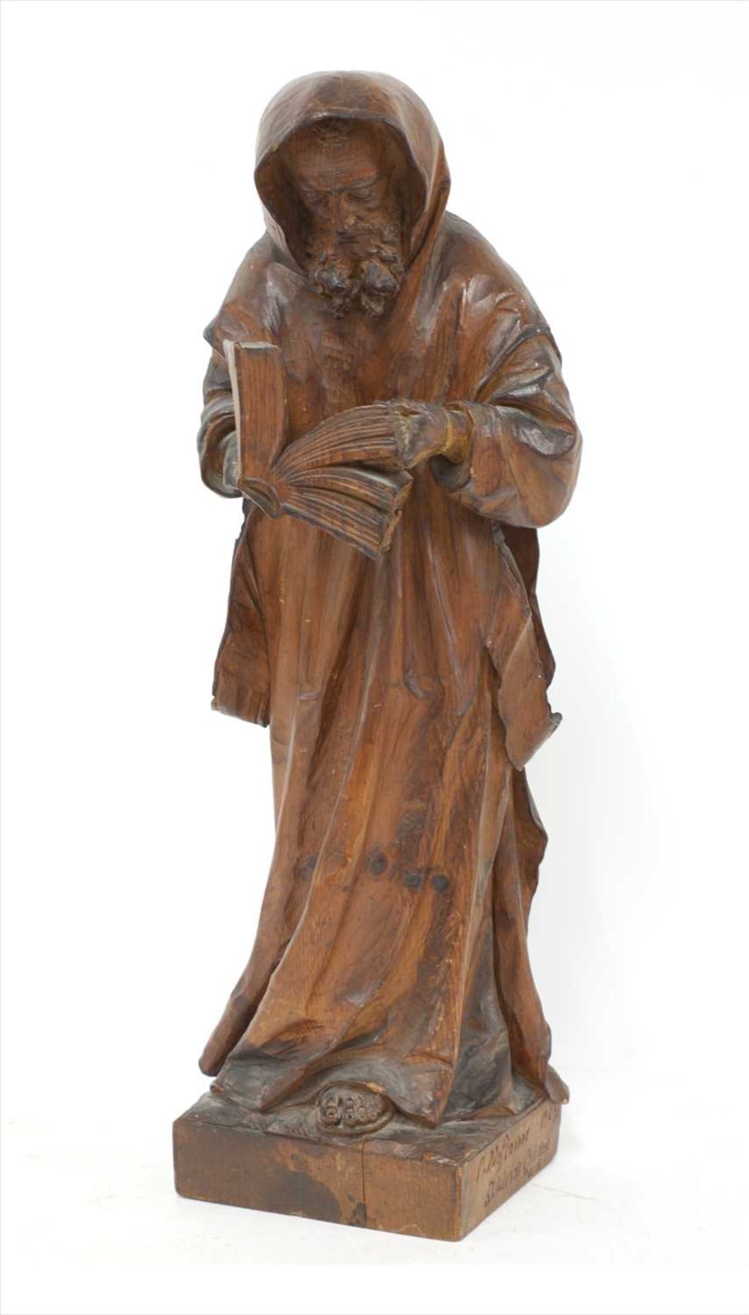 A Tyrolean carved pine figure of a monk