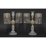 A pair of cut-glass and gilt metal candelabra,