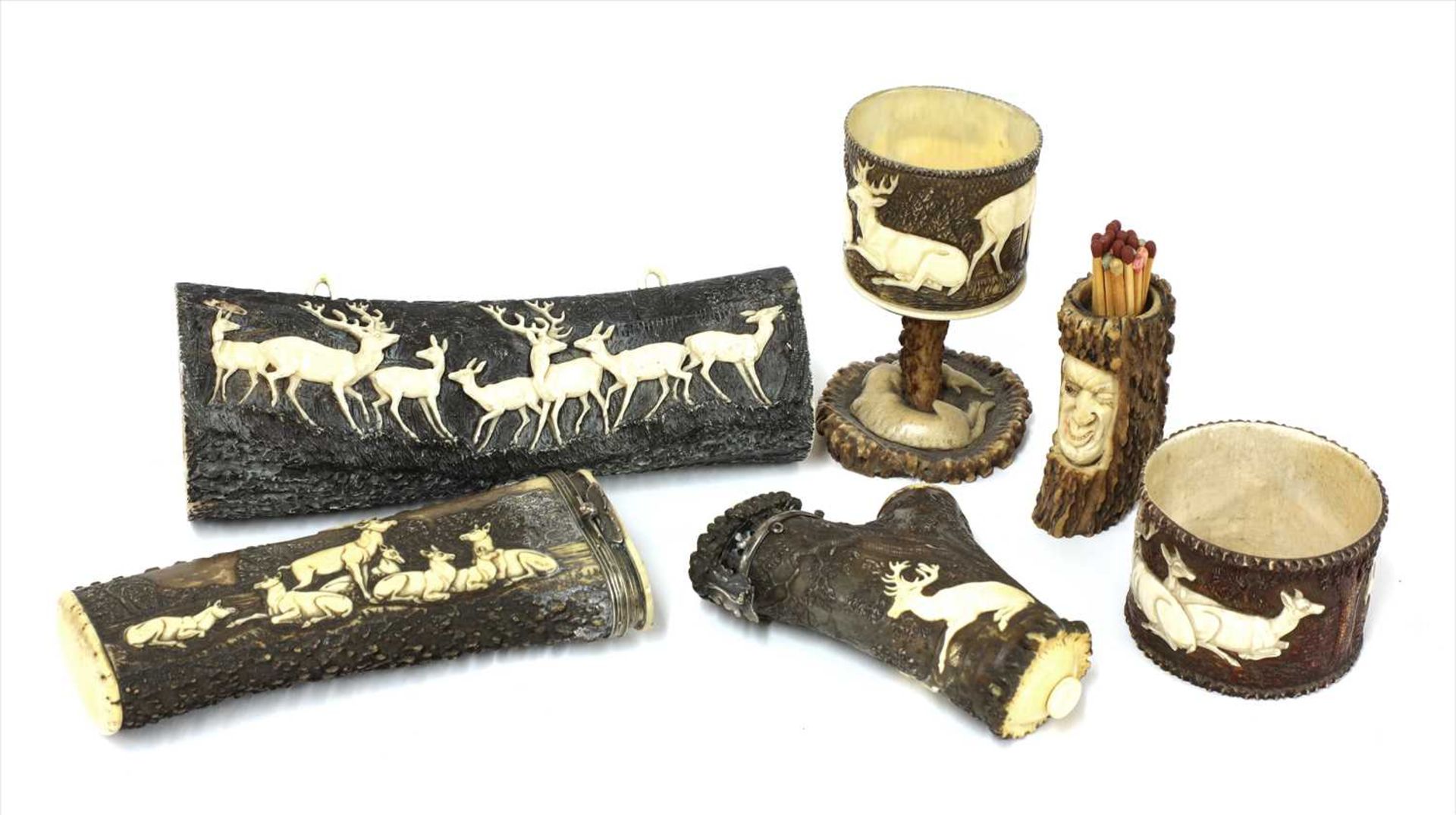 Six carved antler stag hunting items,