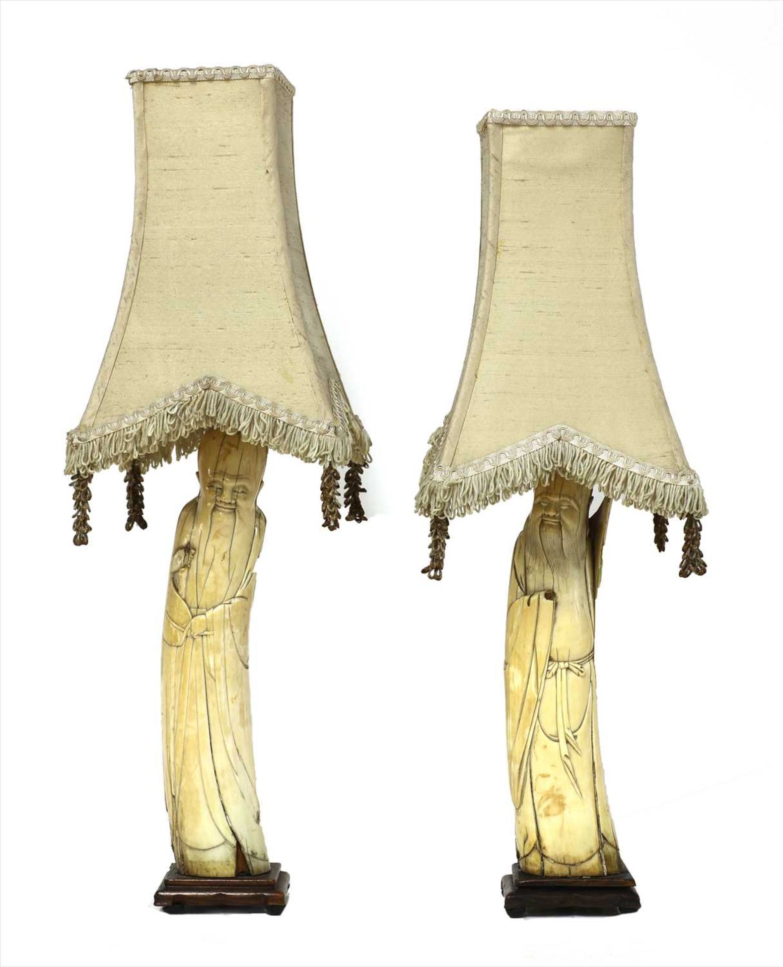 A pair of Chinese ivory tusk figures,