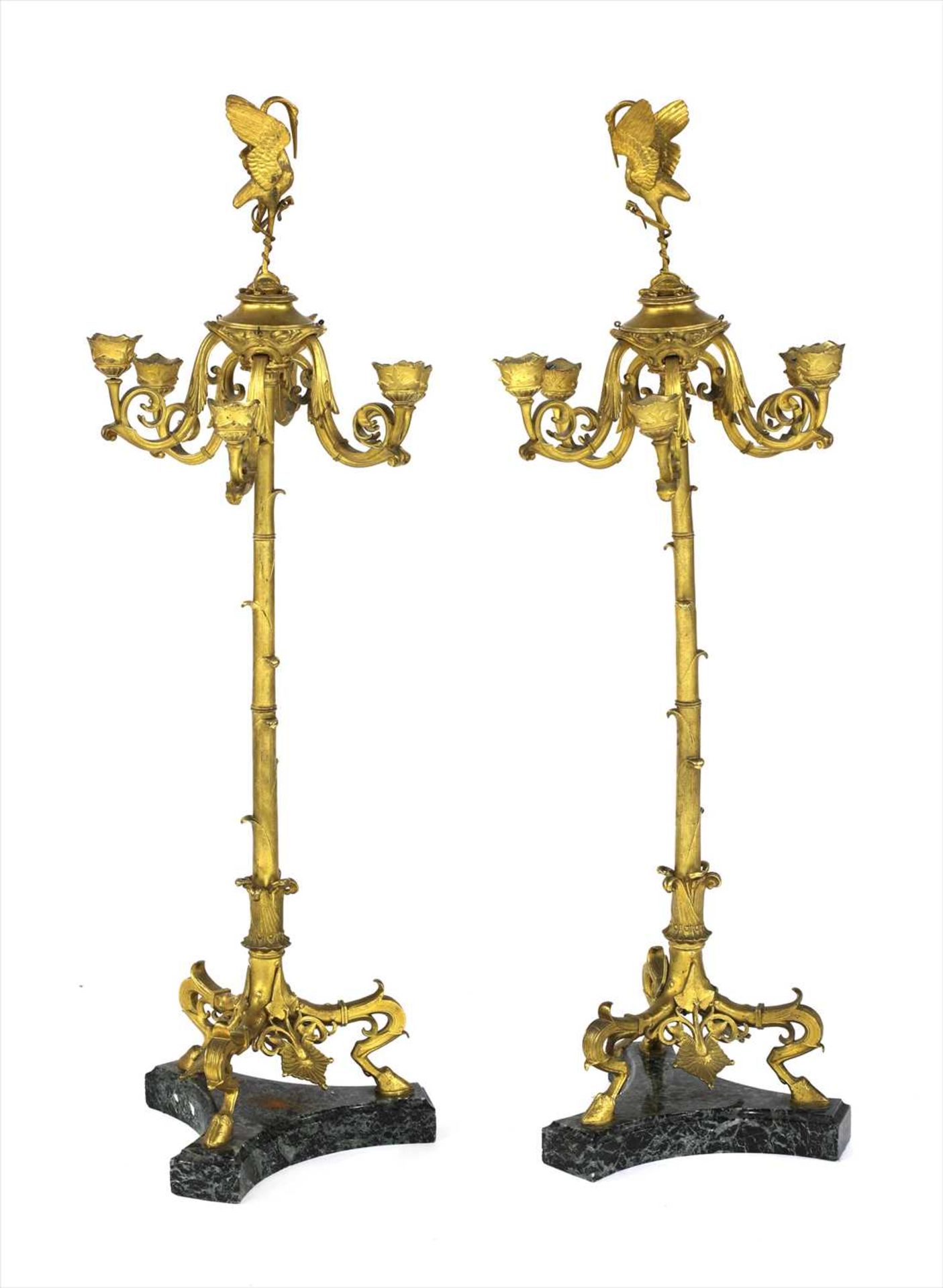 A pair of French gilt brass candlesticks,