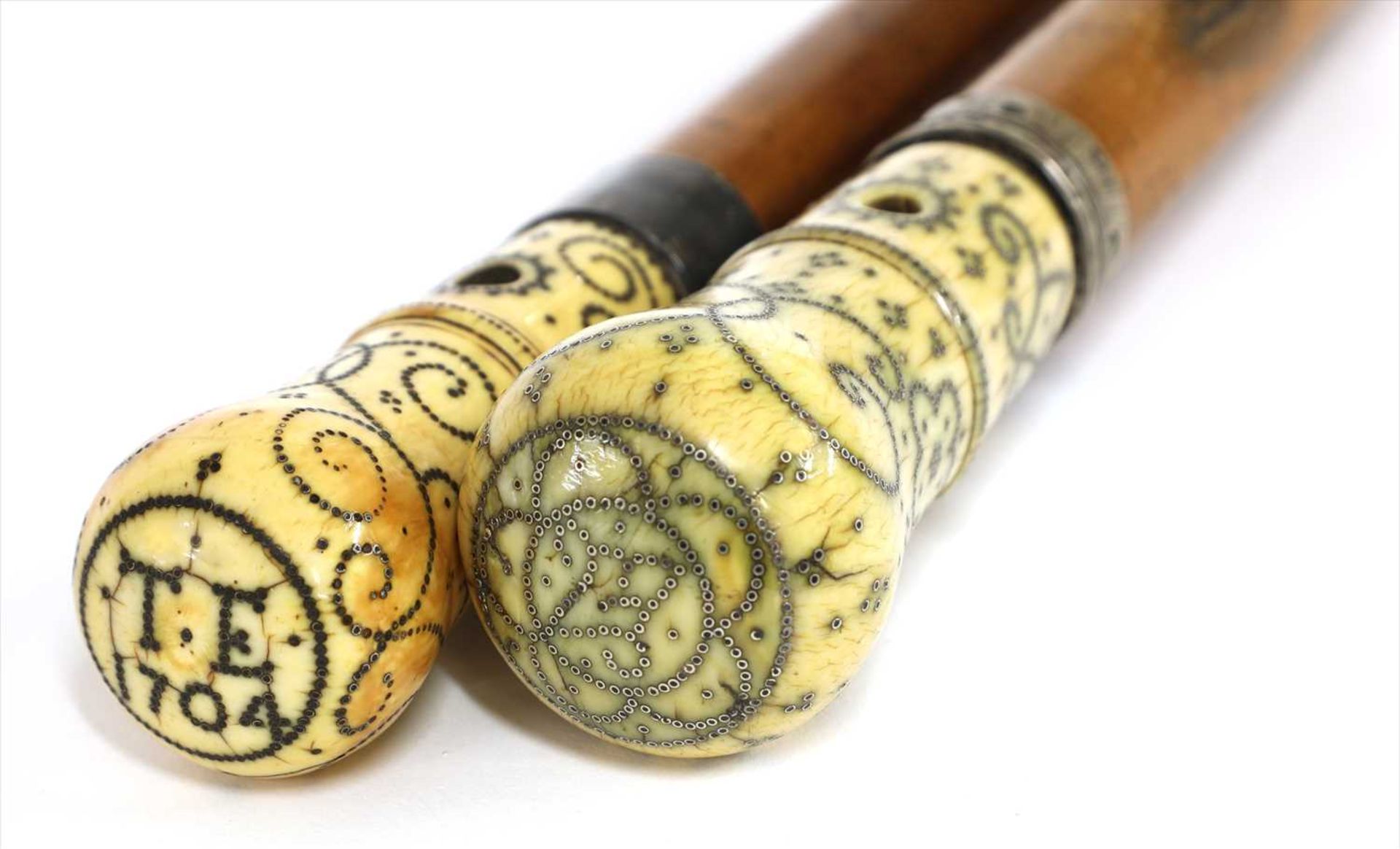 Two Queen Anne period piqué walking sticks,