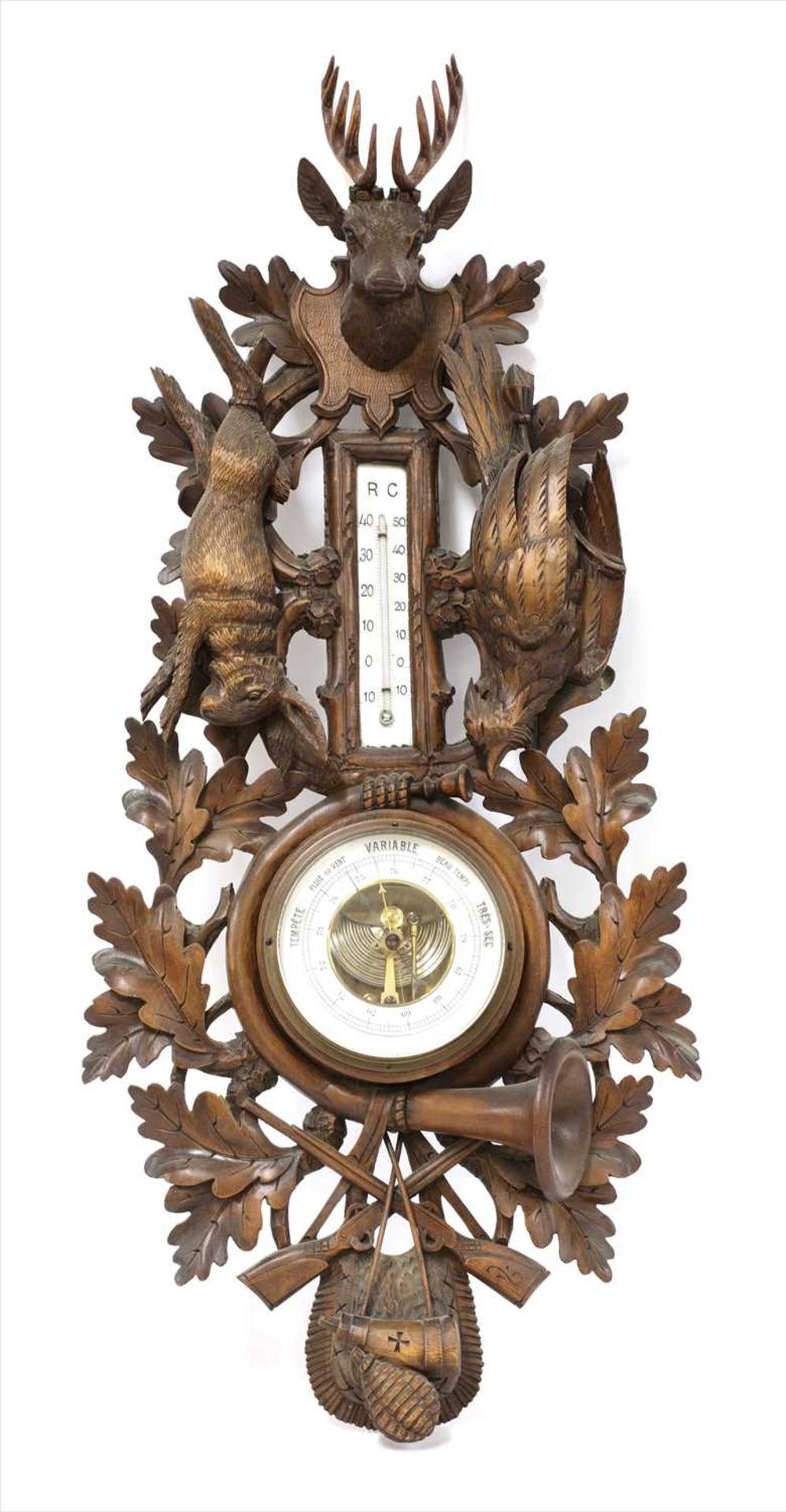 A Black Forest aneroid barometer and thermometer,