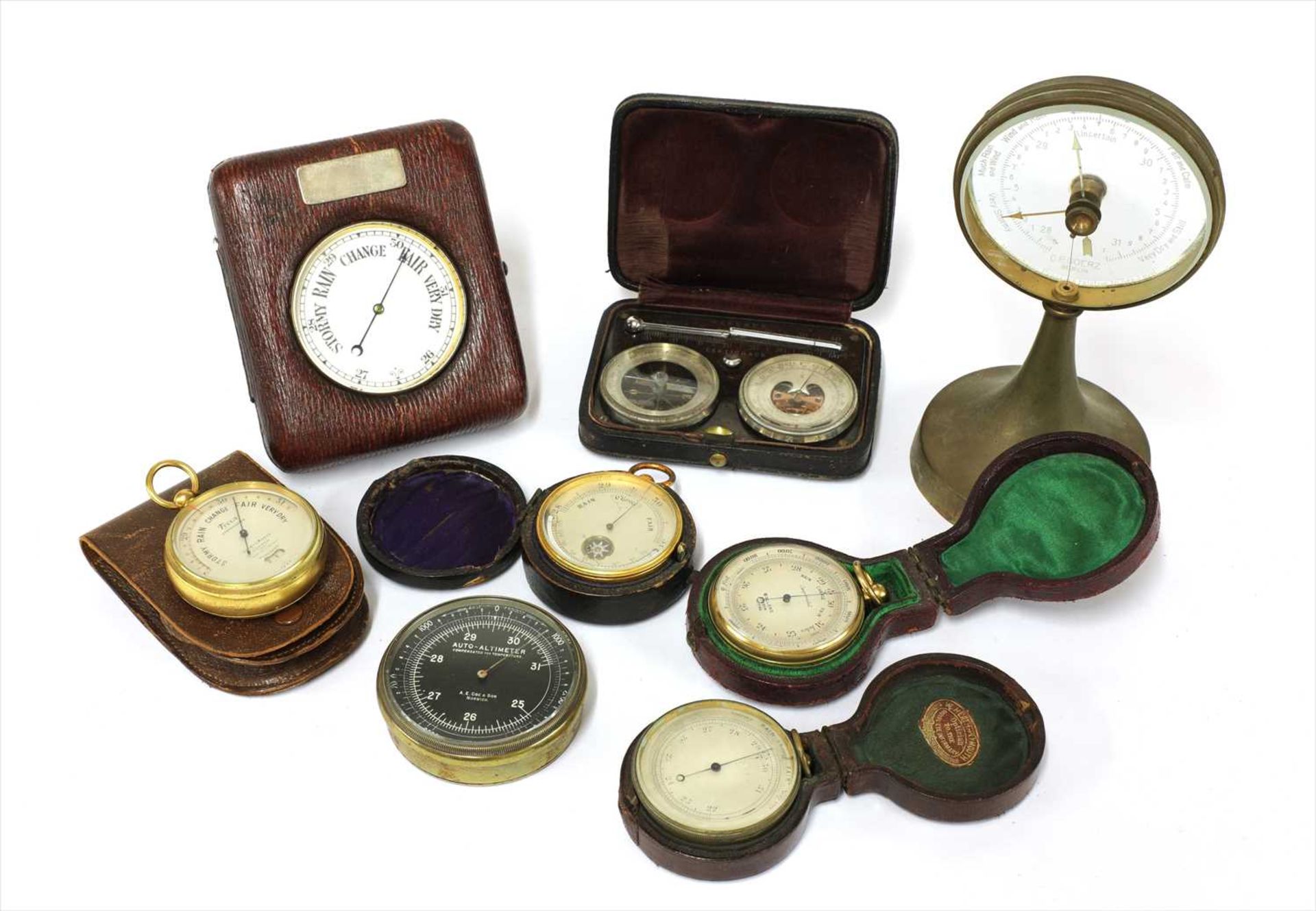 Seven aneroid barometers and an auto-altimeter,