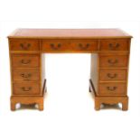 A yew wood pedestal desk,