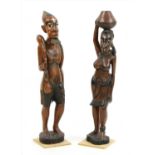 A pair of African carved and painted hardwood figures,