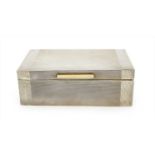 A large cedarwood lined silver cigarette box,