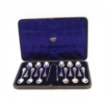 A cased set of silver spoons and tongs,