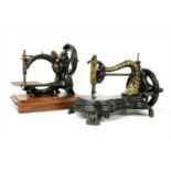 Two Victorian iron sewing machines,