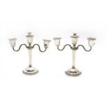 A pair of modern silver twin branch candelabra,