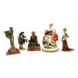 A group of ceramic figures,