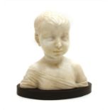 A small alabaster carved bust of a young child,