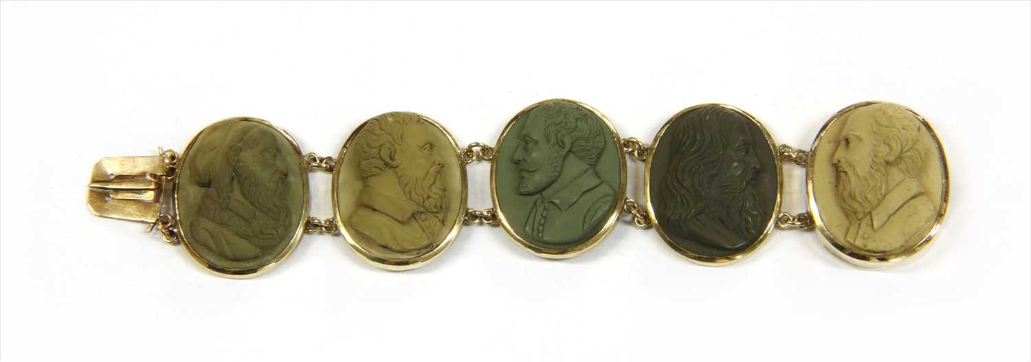 A gilt metal lava cameo bracelet,