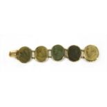 A gilt metal lava cameo bracelet,