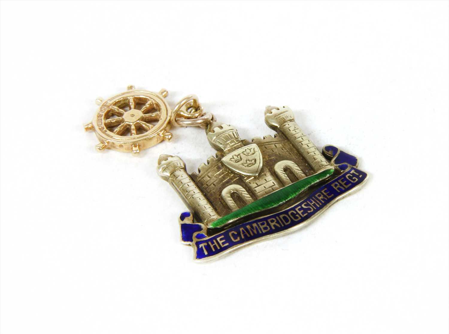 A white gold enamel Cambridgeshire Regiment military sweetheart pendant,