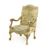 A George II style carved giltwood framed open library armchair,