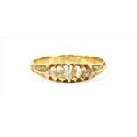 An 18ct gold boat shaped five stone diamond ring