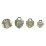 Four silver Tiffany & Co. tags