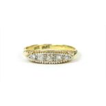A gold boat shaped five stone diamond ring
