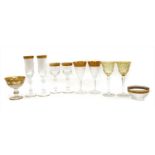 A suite of Moser gilt heightened glassware,