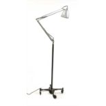 A mid 20th century anglepoise lamp on castors