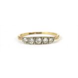 A gold five stone diamond ring