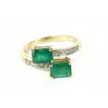 A 9ct gold emerald crossover ring,