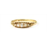 An 18ct gold boat shaped five stone diamond ring
