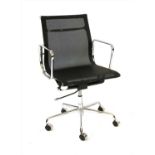 An Eames black mesh and chrome office chair