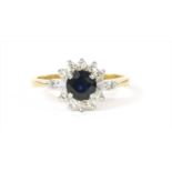 An 18ct gold sapphire and diamond cluster ring