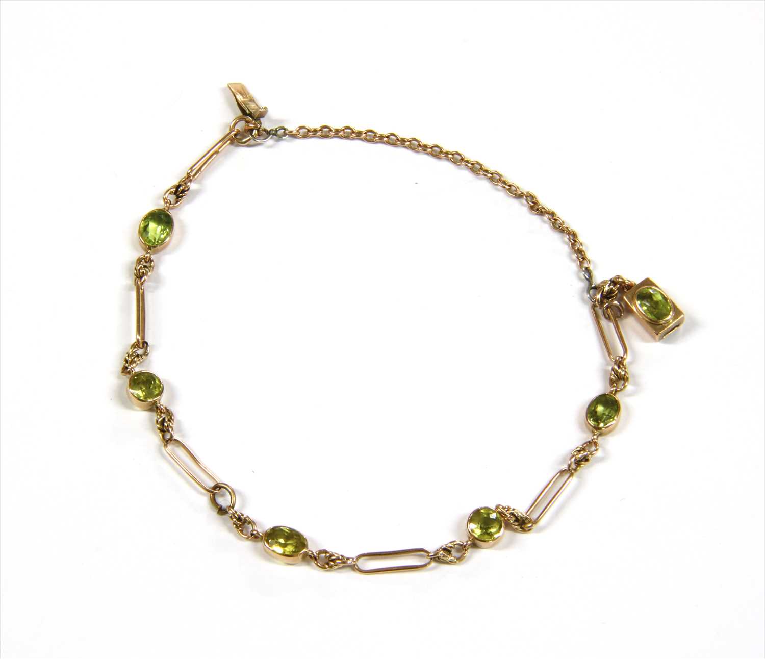 A gold peridot bracelet,