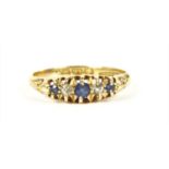 An 18ct gold boat shaped sapphire and diamond ring