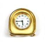 A Cartier gilt metal travel alarm clock,