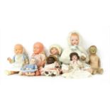 A large collection of dolls,