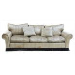 A pair of modern three-seat settees,