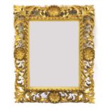 A Florentine carved wood and gilt mirror,