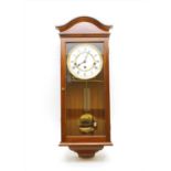 A Comitti of London mahogany cased wall clock,