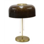 A table lamp with a domed plastic shade,