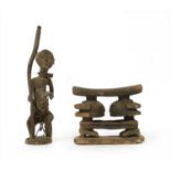An Ashanti carved wood figural headrest,