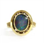 A gold opal triplet ring