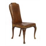 A walnut side chair with original leather,