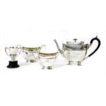 A three piece silver tea set,