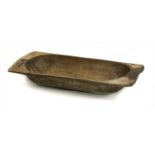A large carved wooden basin,
