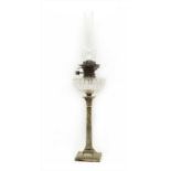 An Edwardian Corinthian column oil lamp,