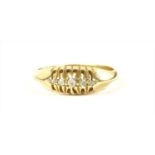 An 18ct gold boat shaped five stone diamond ring